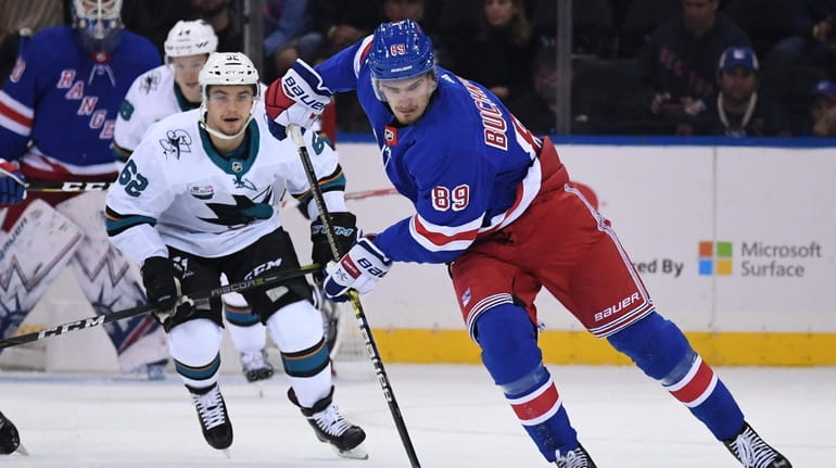 New York Rangers right wing Pavel Buchnevich skates with the...
