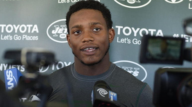New York Jets outside linebacker Darron Lee answers questions from...