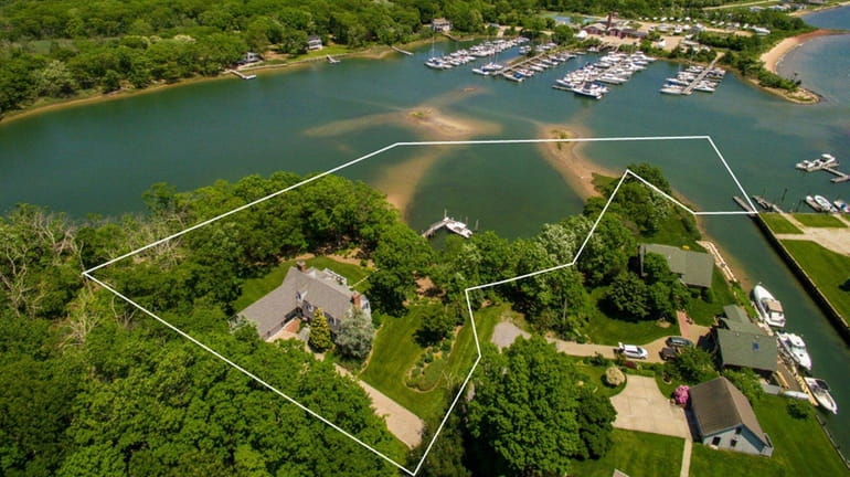 The Southold property is on 1.4 acres and includes two...