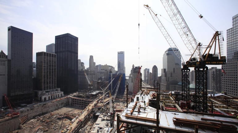 World Trade Center Tower 4, center left, under construction by...