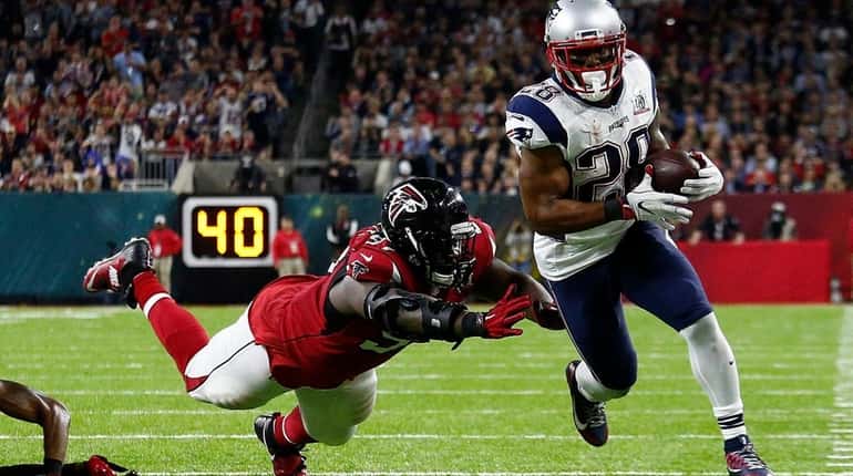 New England Patriots running back James White outruns Atlanta Falcons...