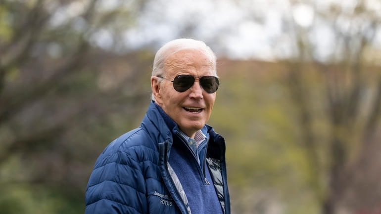 President Joe Biden walks to Marine One for departure from...