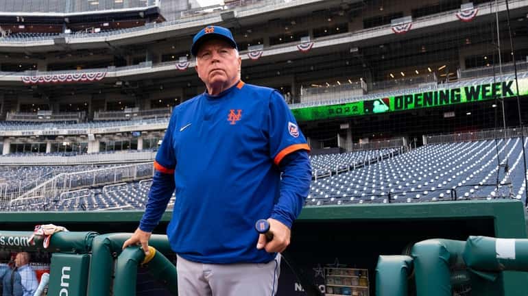 Mets manger Buck Showalter pauses before coming on the field...