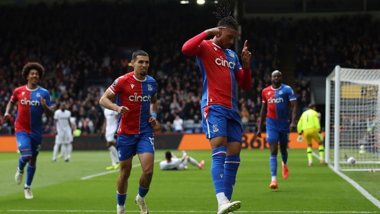 Crystal Palace's Michael Olise celebrates scoring their first goal of...