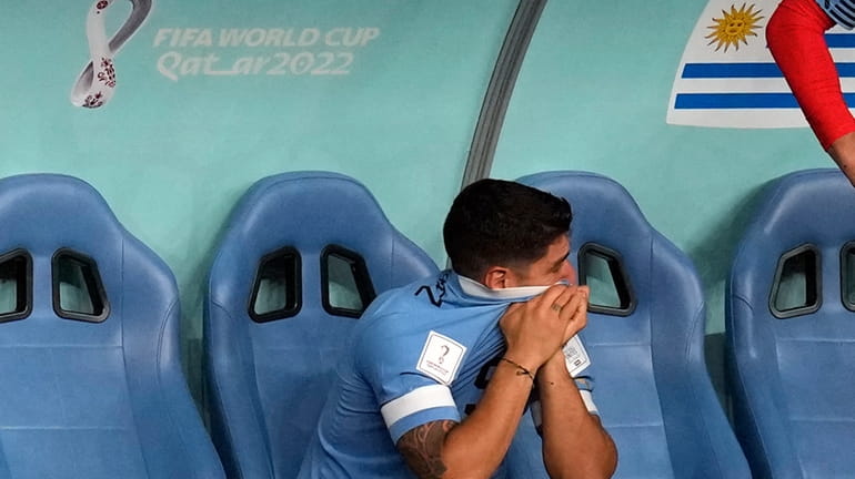 Uruguay's Luis Suarez sits on the bench during the World...