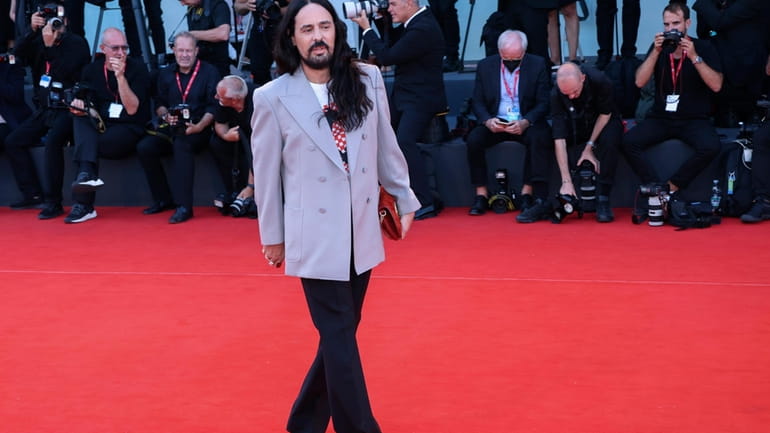 Alessandro Michele poses for photographers upon arrival at the premiere...