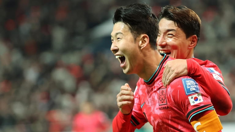 South Korea's Son Heung-min celebrates after scoring his side's first...