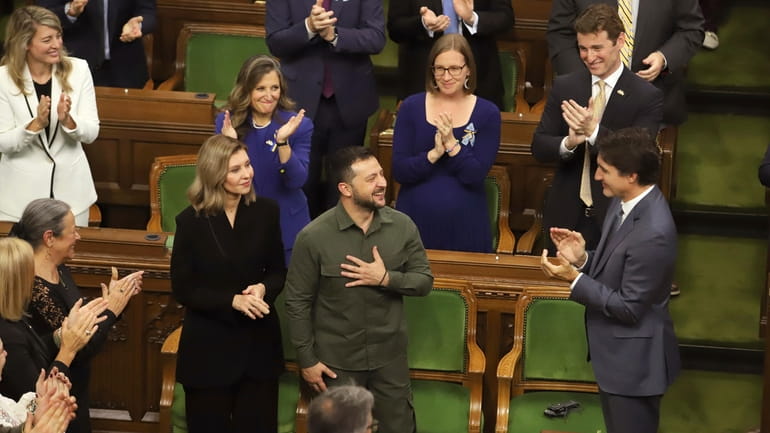 Ukrainian President Volodymyr Zelenskyy receives a standing ovation from Canadian...