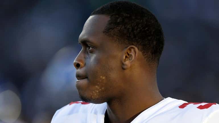 Giants quarterback Geno Smith stands on the sideline during the...