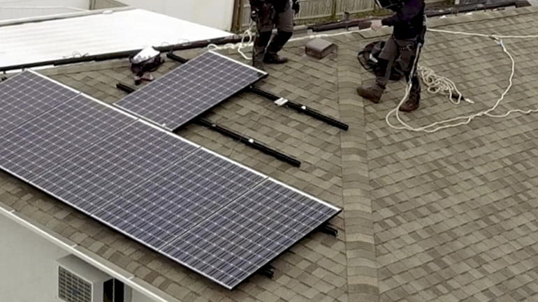 Drone video showing the installation of solar panels on the...