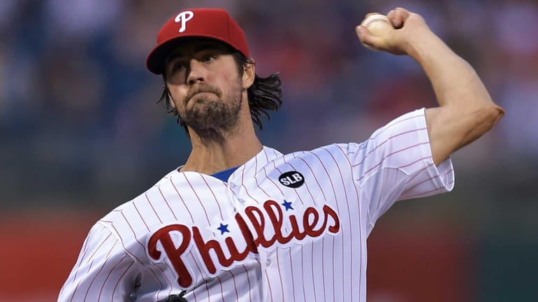 Starting pitcher Cole Hamels of the Philadelphia Phillies delivers a...
