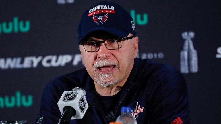 Capitals head coach Barry Trotz speaks while answering questions from...