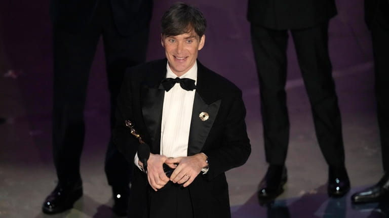Cillian Murphy accepts the award for best performance by an...