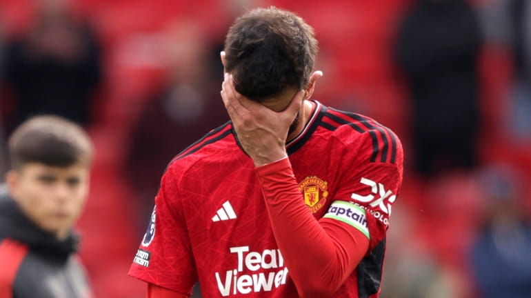 Manchester United's Bruno Fernandes reacts after the English Premier League...