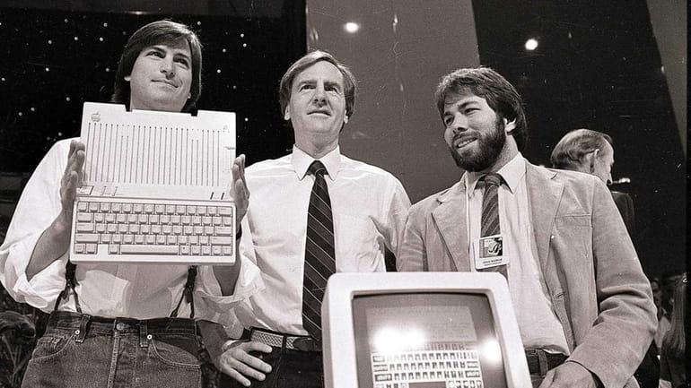 Steve Jobs, left, chairman of Apple Computer, John Sculley, president...