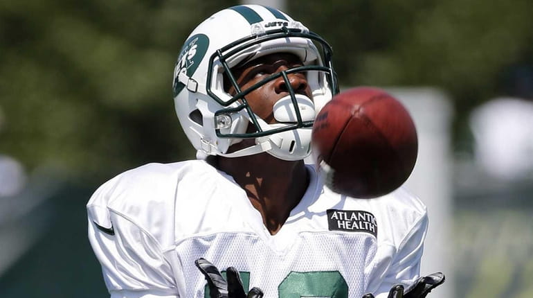 Jets wide receiver Walter Powell catches a punt during training...