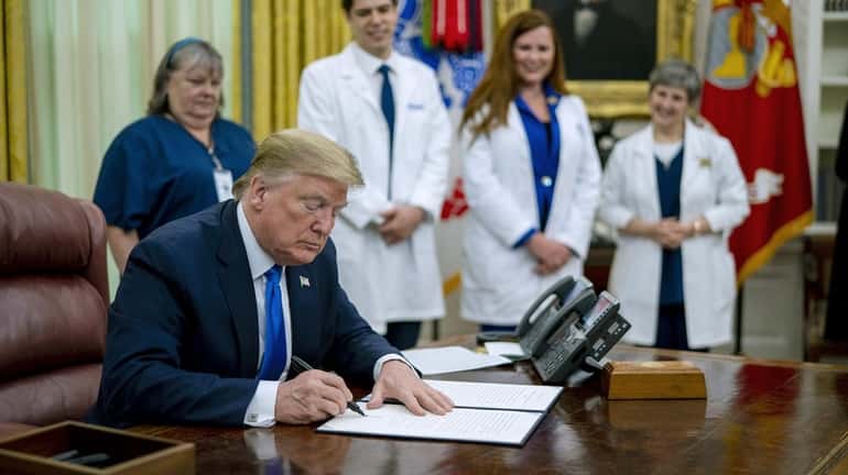 President Donald Trump signs a proclamation honoring National Nurses Day...