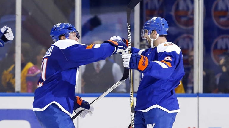 Nick Leddy #2 of the New York Islanders celebrates his...