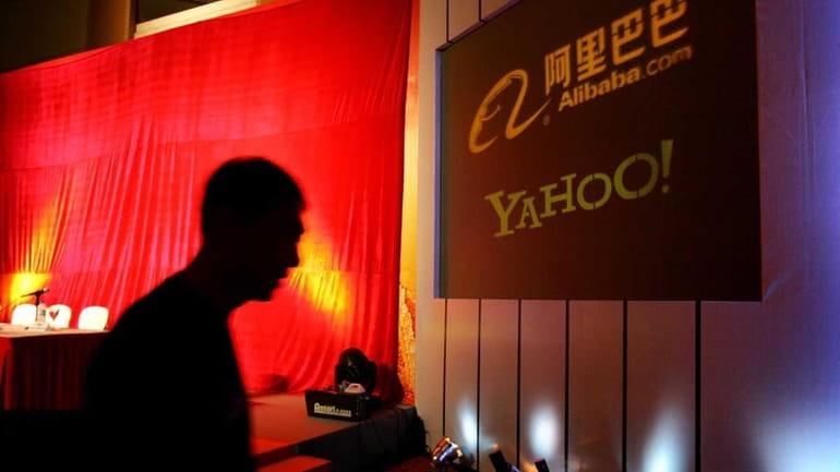 A banner in Beijing shows the business relationship between Yahoo...