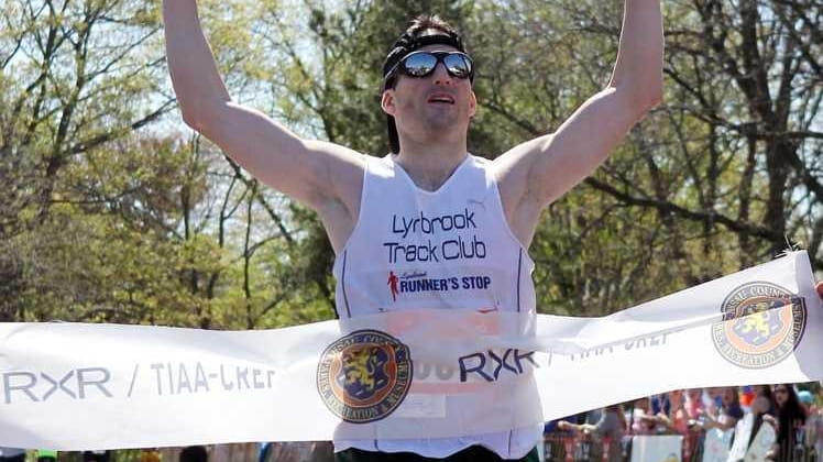 Shaun McGrath of Lynbrook crosses the finish line as the...