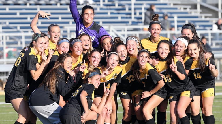 St. Anthony's celebrates after winning the CHSAA state girls soccer...