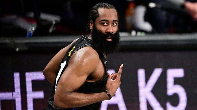 James Harden of the Nets celebrates a three-point basket against the...