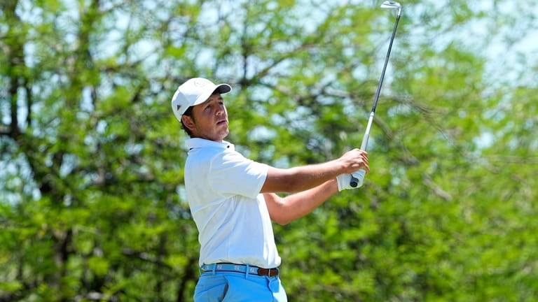 North Carolina golfer Dylan Menante hits from the second tee...