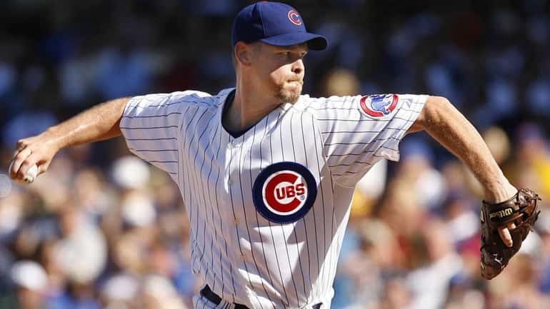 Chicago Cubs pitcher Kerry Wood delivering a pitch against the...