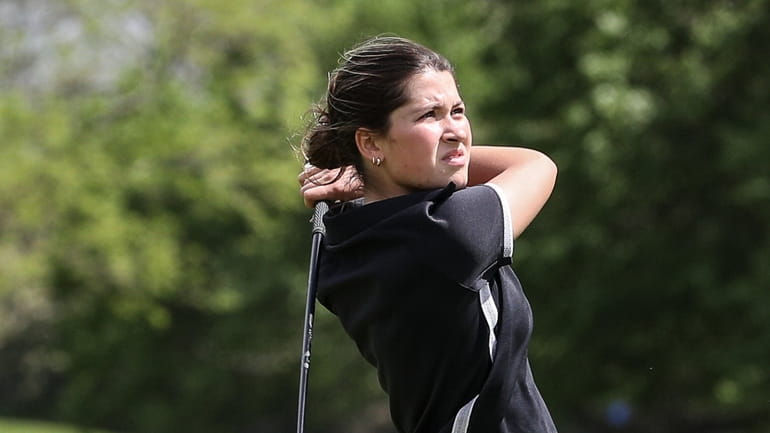 Grace London of St. Anthony's tees off on the 18th...