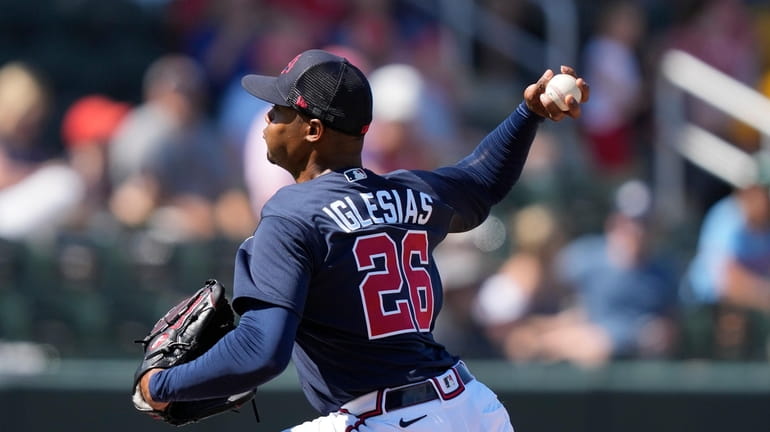 Atlanta Braves relief pitcher Raisel Iglesias (26) throws in the...