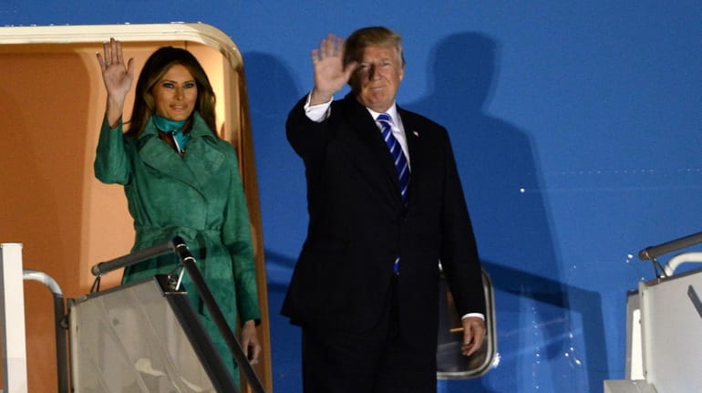First lady Melania Trump and President Donald Trump arrive in...