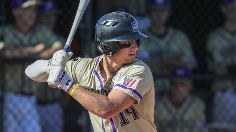 Brock Murtha #14 of Sayville bats against Rocky Point during the...