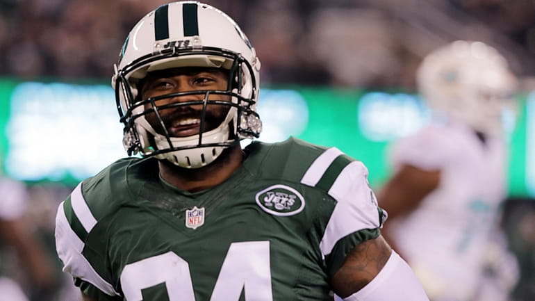 New York Jets cornerback Darrelle Revis reacts after knocking down a...