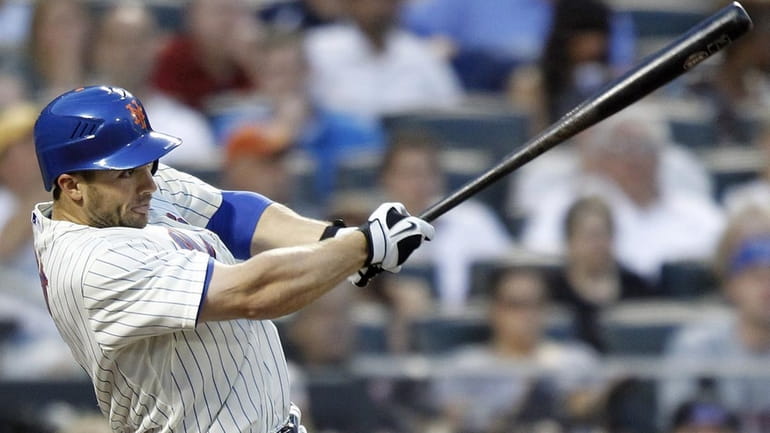 New York Mets' David Wright doubles in a run in...