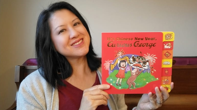 Maria Wen Adcock, of Huntington, with her new book, “It’s...
