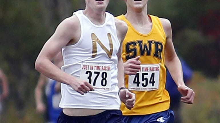 Northport's Mike Brannigan (378) stays just ahead of Shoreham Wading-River's...