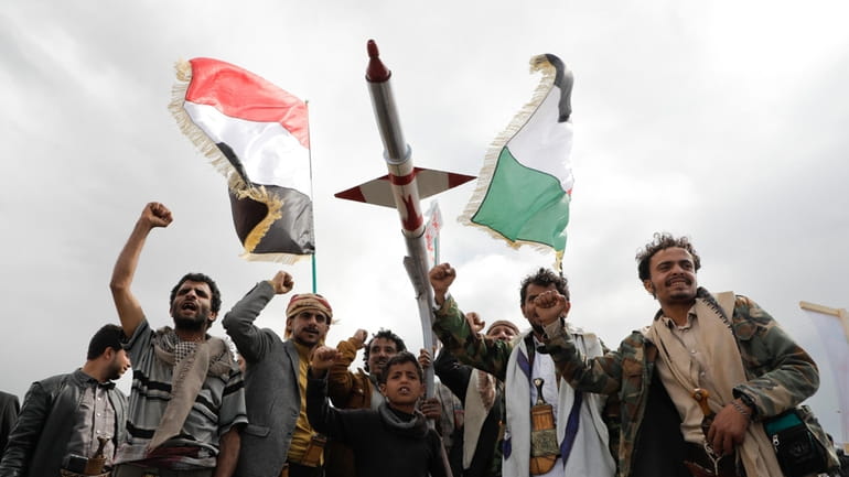 Houthi supporters attend a rally against the U.S. airstrikes on...