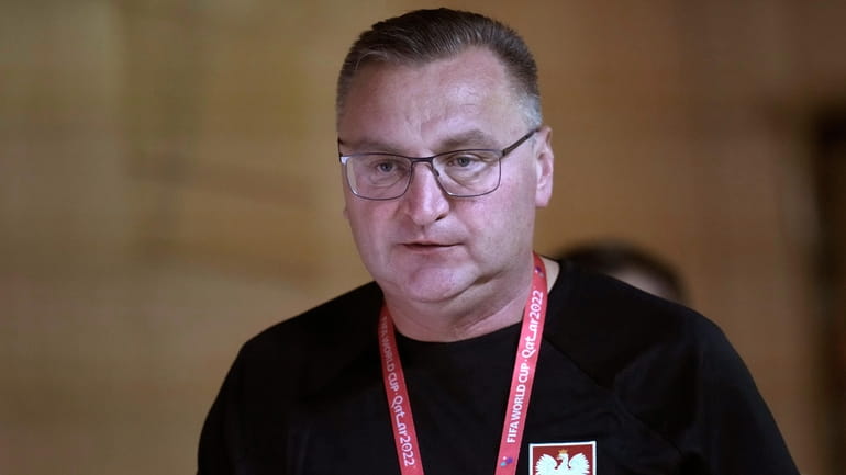 Poland's head coach Czeslaw Michniewicz arrives for a press conference...