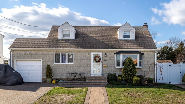 Priced at $639,000, this Cape on Dorothy Drive features a...