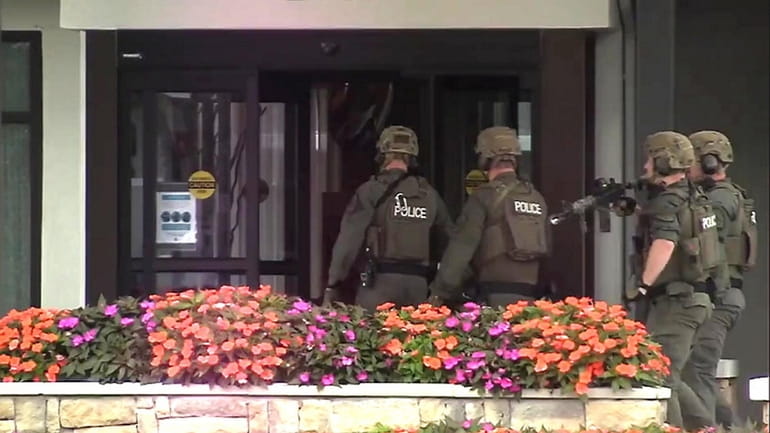 Police enter the Courtyard by Marriott in Poughkeepsie on Oct....
