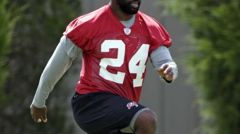 Tampa Bay Buccaneers cornerback Darrelle Revis stretches his legs as...