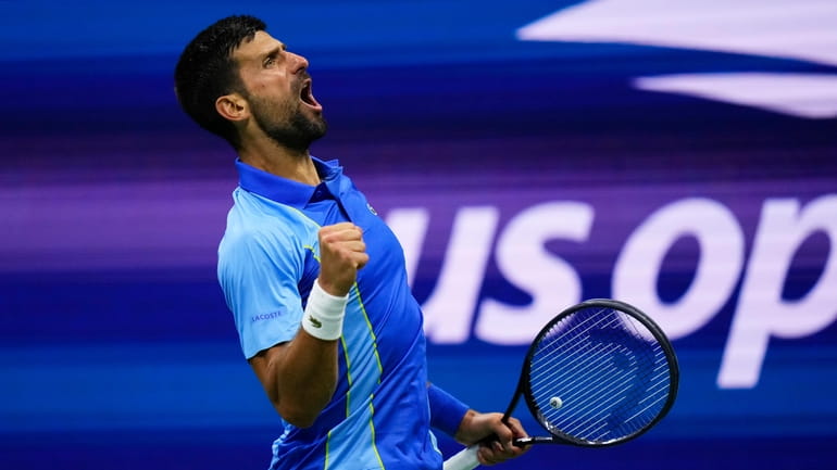Novak Djokovic, of Serbia, reacts during a match against Laslo...