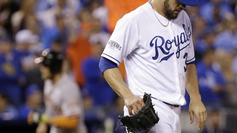 Kansas City Royals pitcher James Shields reacts after giving up...