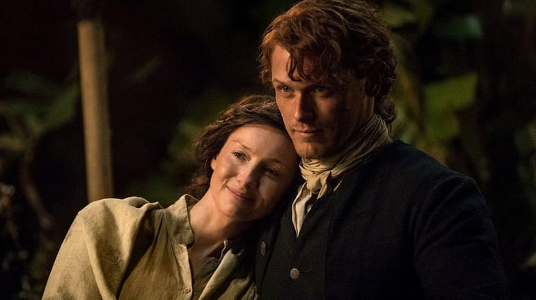 Caitriona Balfe and Sam Heughan in an episode from season...