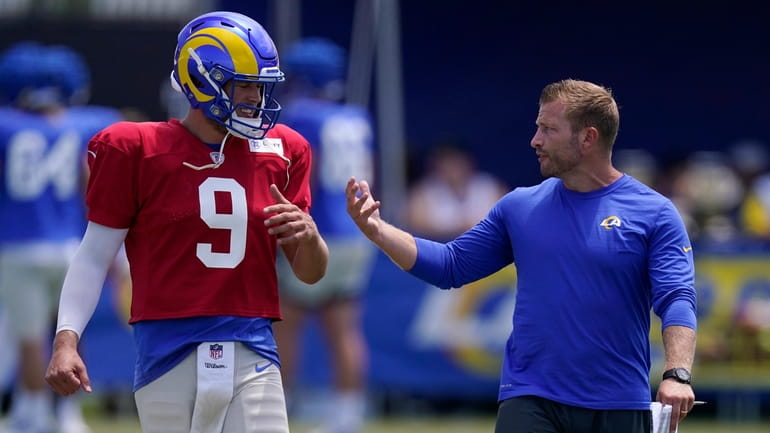 Los Angeles Rams head coach Sean McVay, right, speaks with...