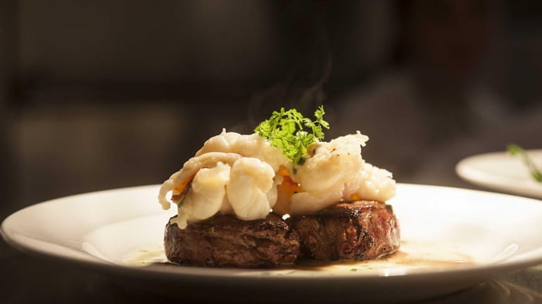 Seared beef tenderloin is served with a butter-poached lobster tail...