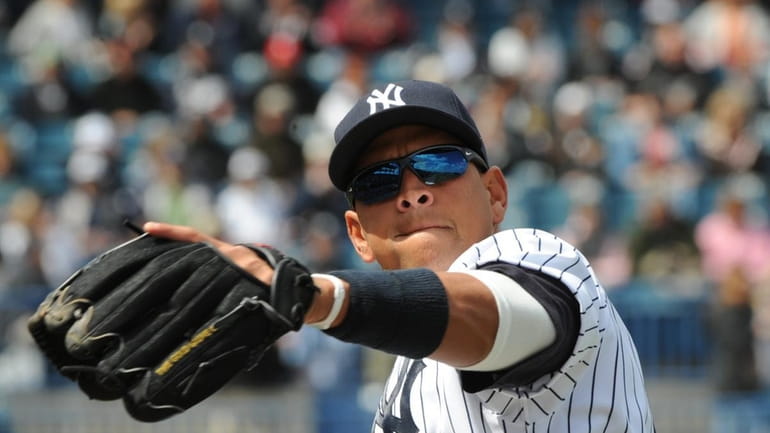 Alex Rodriguez warms up for play in the first spring...