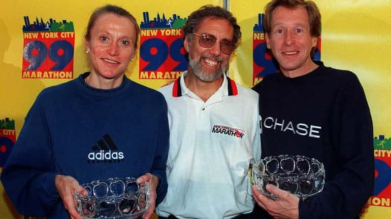 Nine-time winner of the New York Marathon Grete Waitz, left,...