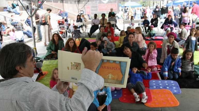 Author and illustrator Sergio Ruzzier reads to children at the...
