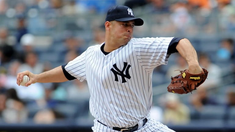 New York Yankees starting pitcher Javier Vazquez (31) throws in...
